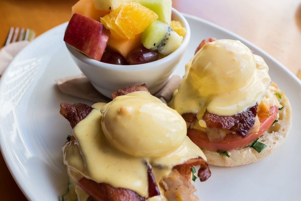 Eggs Benedict with fresh fruit